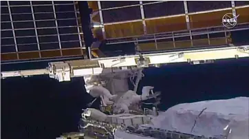  ?? NASA VIA AP ?? In this image taken from video, NASA astronaut Shane Kimbrough, left, and French astronaut Thomas Pesquet work on the solar array outside the Internatio­nal Space Station on Sunday.