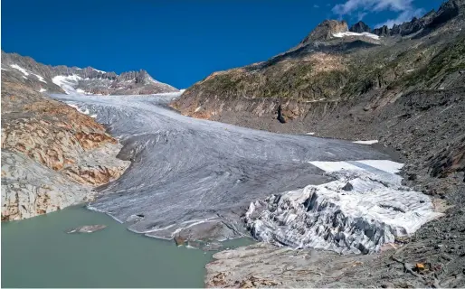  ?? AFP ?? The Rhone Glacier and its glacial lake, near Gletsch in Switzerlan­d. The glacier is melting as heatwave sweeps across northern Europe. —