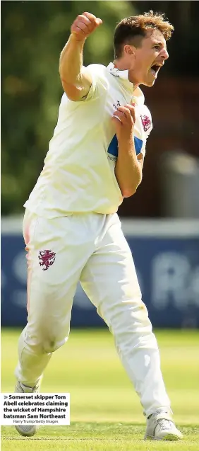  ?? Harry Trump/Getty Images ?? > Somerset skipper Tom Abell celebrates claiming the wicket of Hampshire batsman Sam Northeast