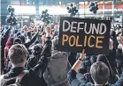  ?? JOHN MINCHILLO/ AP ?? Protesters demand police defunding Oct. 14 in New York.