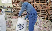  ?? [AP PHOTO] ?? In this Nov. 1 photo, workers in a warehouse pack “super beans” into branded bags, part of a substantia­l consignmen­t ordered by the U.N.’s Food and Agricultur­e Organizati­on as planting materials for refugees sheltering in northern Uganda, in...