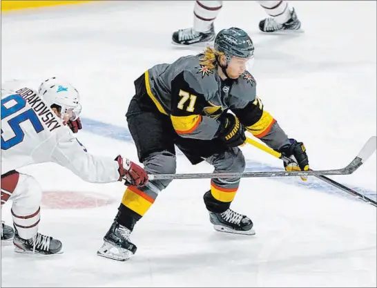  ?? David Zalubowski The Associated Press ?? Golden Knights center William Karlsson uses his reach to keep the puck away from the checking of Colorado’s Andre Burakovsky in the first period.