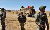  ?? File ?? Turkish and US soldiers patrol together in Tal Abyad city, near Turkiye’s border, in Syria, on Sept. 8, 2019.