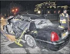  ?? KATHY WILLENS / AP ?? A police officer tows a car after an accident in New York on Wednesday that killed longtime “60 Minutes” correspond­ent Bob Simon.