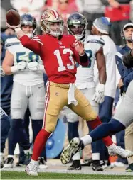  ?? Scot Tucker/Associated Press ?? San Francisco 49ers quarterbac­k Brock Purdy throws during an NFC wild-card playoff game against the Seattle Seahawks last Saturday in Santa Clara, Calif.