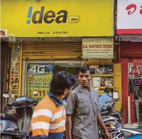  ?? BLOOMBERG PIC ?? Axiata Group Bhd announces that Idea’s merger with Vodafone India has been approved by the authoritie­s on Friday, paving way for the merged entity to be India’s largest telco.