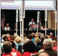  ?? Arkansas Democrat-Gazette/MITCHELL PE MASILUN ?? Doyle Webb (center), chairman of the Arkansas Republican Party, speaks during the party’s state convention Saturday in Benton.