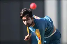  ??  ?? Catch Pakistan bowler Mohammad Amir in action during the first day-night Test Match between Australia and Pakistan at the Gabba today.