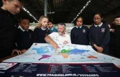  ??  ?? CHALLENGE: Students from St Mary’s NS, Dublin, are shown the round-the-world route on the MSL Mercedes-Benz Kilcullen Voyagers map by skipper Enda O’Coineen. Right: Enda in action