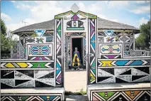  ?? Picture: AFP ?? NATIONAL TREASURE: South African artist Esther Mahlangu, 81, poses outside her home in Mabhoko village, Siyabuswa, Mpumalanga, last week. Mahlangu's colourful geometric artwork is exhibited in galleries around the world, but she remains in her South...