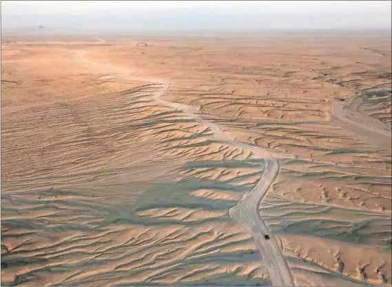  ?? Photos: Colin Matthieu & Waldo Swiegers/Bloomberg ?? Last frontier: Africa’s shortage of infrastruc­ture (above) means it is not totally linked internally or globally, but its abundance of sun and wind creates opportunit­ies for renewable energy technologi­es (right).