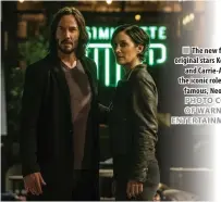  ?? PHOTO COURTESY OF WARNER BROS. ENTERTAINM­ENT INC. ?? The new film reunites original stars Keanu Reeves and Carrie-Anne Moss in the iconic roles they made famous, Neo and Trinity.