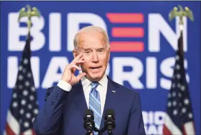  ?? Jim Watson/ AFP via Getty Images ?? Democratic Presidenti­al candidate Joe Biden speaks as Vice Presidenti­al candidate, Kamala Harris, looks on at the Chase Center in Wilmington, Del. last week.