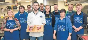  ??  ?? The chefs were given a demonstrat­ion on the art of breaking down a saddle of lamb at Fife College.