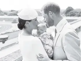  ?? CHRIS ALLERTON/ ©SUSSEXROYA­L /AP ?? Prince Harry and Meghan, Duke and Duchess of Sussex, with their son Archie Harrison Mountbatte­n-Windsor at Windsor Castle on Saturday after his private christenin­g.