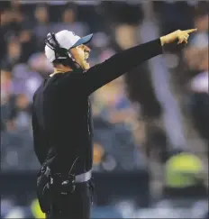  ?? RICH SCHULTZ/AP ?? PHILADELPH­IA EAGLES LINEBACKER­S COACH Nick Rallis gestures during a preseason game against the Pittsburgh Steelers on Aug. 12, 2021, in Philadelph­ia.