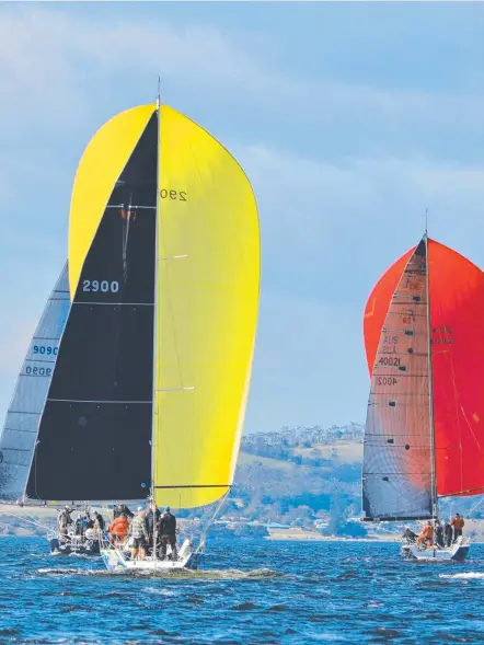  ?? ?? The Hobart yacht racing fleet laps up perfect conditions under spinnaker on the Derwent. Picture Colleen Darcey.JPG