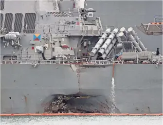  ?? WONG MAYE-E, AP ?? The collision of the USS John S. McCain with a tanker near Singapore is the Navy’s second deadly accident at sea in two months. Divers were still searching for 10 missing sailors.