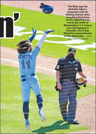  ?? JULIO AGUILAR/GETTY IMAGES ?? The Blue Jays' Bo Bichette takes a jumpshot with his batting helmet after rounding third base on his walkoff home run in the ninth of Wednesday's 5-4 victory over the Yankees in Dunedin, Fla. It was Bichette's second homer of the afternoon.