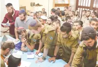  ?? (Itzik Belnitsky/Defense Ministry) ?? HAREDI SOLDIERS gather last Wednesday at the ‘Profession for a Lifetime’ employment fair in Jerusalem.