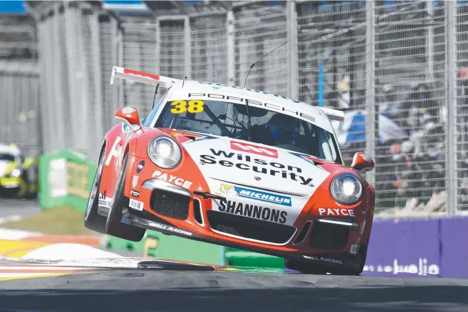  ?? Picture: BRENDAN RADKE ?? David Wall pushed his Porsche to the limits to ensure he claimed the Carrera Cup title on the Gold Coast yesterday.