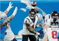  ?? DUANE BURLESON THE ASSOCIATED PRESS ?? Houston Texans quarterbac­k Deshaun Watson (4) throws under pressure during the first half against the Lions in Detroit on Thursday. The Texans won the game, 41-25.