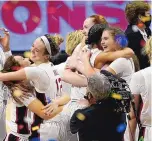 ?? ERIC GAY/ASSOCIATED PRESS ?? Stanford players celebrate at the end of the NCAA women’s championsh­ip game against Arizona. Stanford won 54-53.