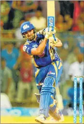  ??  ?? Mumbai Indians captain Rohit Sharma plays a shot during the IPL match against Royal Challenger­s Bangalore at The Wankhede Stadium in Mumbai on Monday.