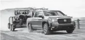  ?? BLAKE JORGENSON/HONDA ?? The 2021 Honda Ridgeline, an example of a midsize pickup truck with respectabl­e towing and hauling capability.