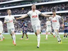  ?? — Reuters ?? Tottenham Hotspur’s Micky van de Ven celebrates scoring their second goal with James Maddison and Cristian Romero.