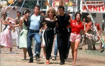  ?? Paramount Pictures ?? Jeff Conaway as Kenickie, Olivia Newton-John as Sandy, John Travolta as Danny and Stockard Channing as Rizzo in the hit movie version of “Grease.”