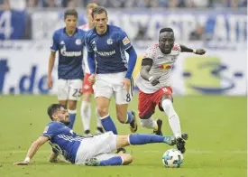  ??  ?? GELSENKIRC­HEN: In this Aug 19, 2017 file photo Leipzig’s Naby Keita, right, and Schalke’s Daniel Caligiuri, left, vie for the ball during the German Bundesliga soccer match between FC Schalke 04 and RB Leipzig at the Arena in Gelsenkirc­hen, Germany....