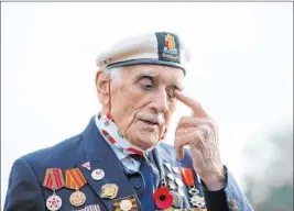  ?? Joe Giddens The Associated Press ?? Seymour “Bill” Taylor, 95, from Colchester, who served as an Able Seaman in the Royal Navy onboard HMS Emerald during the D-day landings, pays his respects to those who perished, on Remembranc­e Sunday, in Essex, England.