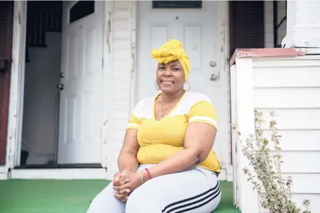  ?? KASSI JACKSON/HARTFORD COURANT ?? Francene Bailey, a certified nursing assistant from Kimberly Hall North, who still is suffering damage from the coronaviru­s and who lost her mom due to COVID-19, sits for a portrait outside of her home in Hartford on Wednesday.