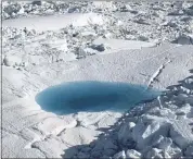  ?? BRENNAN LINSLEY — THE ASSOCIATED PRESS ?? A large melt pool forms in 2011 in the Ilulissat ice fjord below the Jakobshavn Glacier, at the fringe of the vast Greenland ice sheet. The Arctic is warming three times faster than the rest of the planet.