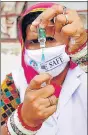  ?? ANI ?? A health worker fills a syringe with a dose of Covid-19 vaccine during a door-to-door vaccinatio­n at a village in Rajasthan’s Ajmer district.