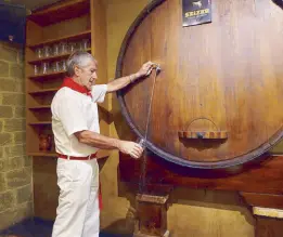  ??  ?? Our host, Angel Urio, pours sidra (cider) from a vat in a sidreria, which also serves delicious bacalao, callos and hamon iberico.