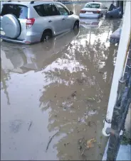  ?? PHOTO COURTESY OF KRISTA DETWEILER ?? Krista Detweiler was able to drive her Toyota RAV 4 out of the flood on Walnut Street Tuesday evening by driving it in reverse up the street.