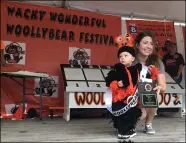  ?? ?? Michael Jessel Jr., 17months, was named the 2021 Woollybear Festival King on stage with his mother, Samantha Jessel.