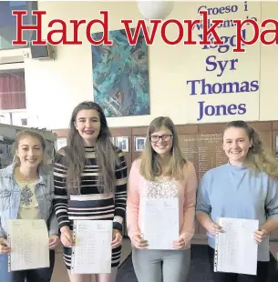  ??  ?? Jessica Parry, Isobelle Rooke, Amber Wells and Molly De’ath, above, and Gwen, Jorja, Livi and Millie, right, from Ysgol Syr Thomas Jones, Amlwch, with their GCSE results