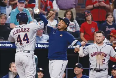  ?? AP PHOTO/ BUTCH DILL ?? Houston Astros’ Yordan Alvarez (44) celebrates with teammates Friday after hitting a two-run home run against the Atlanta Braves during the ninth inning of the baseball game in Atlanta.