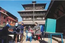  ?? AP ?? A woman casts her vote in Kathmandu yesterday. Millions in Nepal are voting in the final phase of polls for members of the national and provincial assemblies.