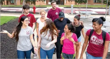  ??  ?? University of Arkansas at Little Rock students give tours of the campus to potential students. This helps give prospectiv­e students a chance to see on-campus life.