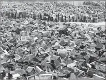  ?? Associated Press ?? DISCARDED television­s pile up in a scrap yard awaiting recycling in China, a testament to endless consumptio­n and growth.