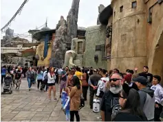  ?? Hugo Martin/Los Angeles Times/TNS ?? ■ Patrons stand in line on the opening day at Star Wars: Galaxy’s Edge on May 31 at Disneyland in Anaheim, Calif.