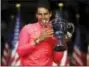  ?? JULIO CORTEZ — THE ASSOCIATED PRESS ?? Rafael Nadal holds up the championsh­ip trophy after beating Kevin Anderson in the men’s singles final of the U.S. Open tennis tournament, Sunday in New York.