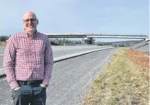  ?? CONTRIBUTE­D ?? Bridgewate­r Mayor David Mitchell is shown near the site of the ongoing constructi­on of a highway interchang­e designed to increase access to the town’s business park and open 125 acres of unused land for developmen­t.