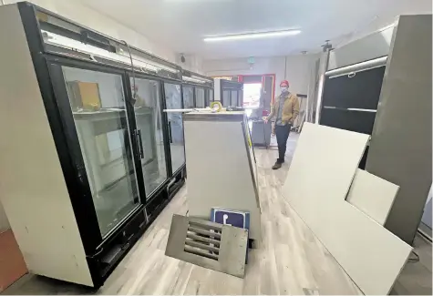  ?? LUIS SÁNCHEZ SATURNO/THE NEW MEXICAN ?? J.P. Bulow, co-owner of Beck & Bulow, walks through the butcher shop under constructi­on last week. Beck & Bulow plans to open the shop this month.