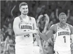  ??  ?? Arizona center Dusan Ristic (14, with Rawle Alkins on Feb. 10) worked out for the Suns on Tuesday at Talking Stick Resort Arena.