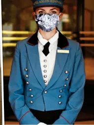  ??  ?? DESIGNER: A trendy mask at a Kempinski hotel. Left: Room service is expected to boom